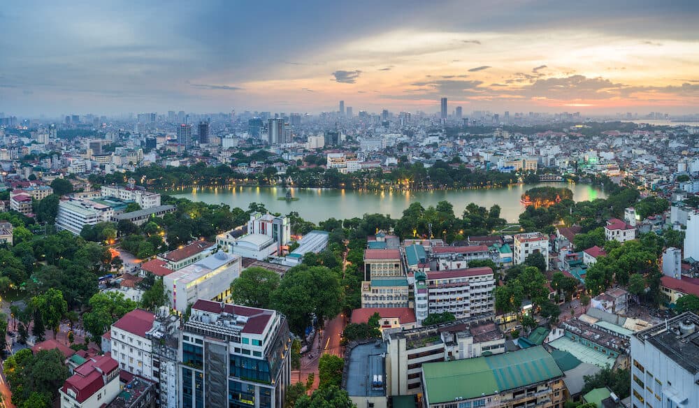 Aerial skyline view of Hoan Kiem lake or Ho Guom, Sword lake area at twilight. Hoan Kiem is center of Hanoi city. Hanoi cityscape.