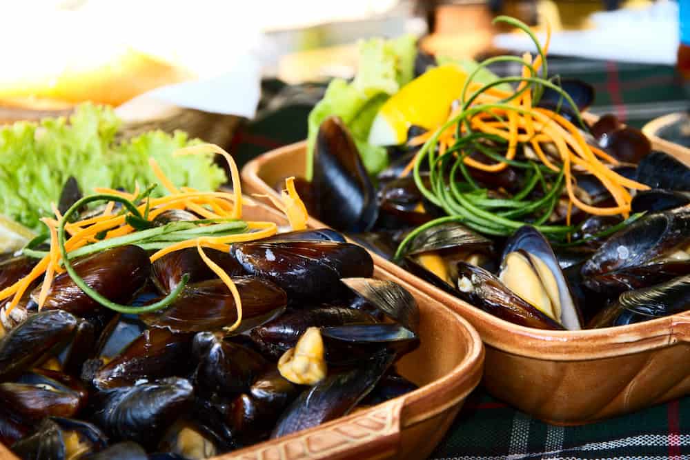 Delicious dish with mussels in the red hot