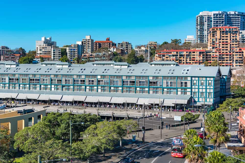 Sydney Australia - : Woolloomooloo historic wharf with restaurants and hotel. Woolloomooloo district cityscape on sunny day