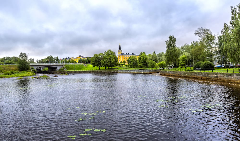 View on the Oulu Cathedral (Oulun tuomiokirkko) and Pokkisenvayla Bridge over Oulujoki river in Oulu.