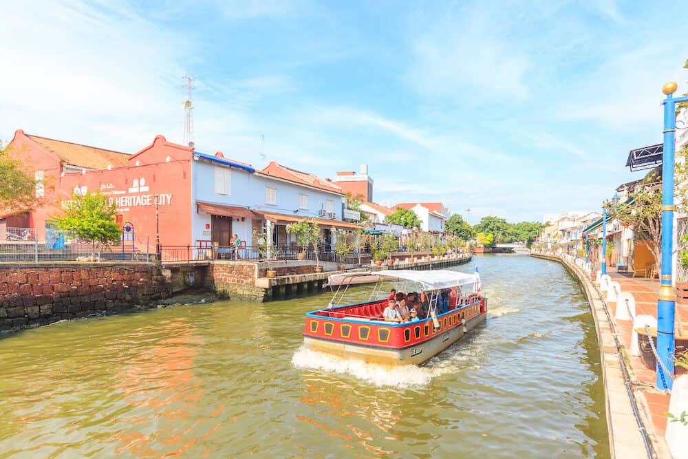 MALACCA, MALAYSIA - Cruise tour boat sails on the Malacca River in Malacca. Rehabilitation of the Malacca River to develop river tourism started in July 2002