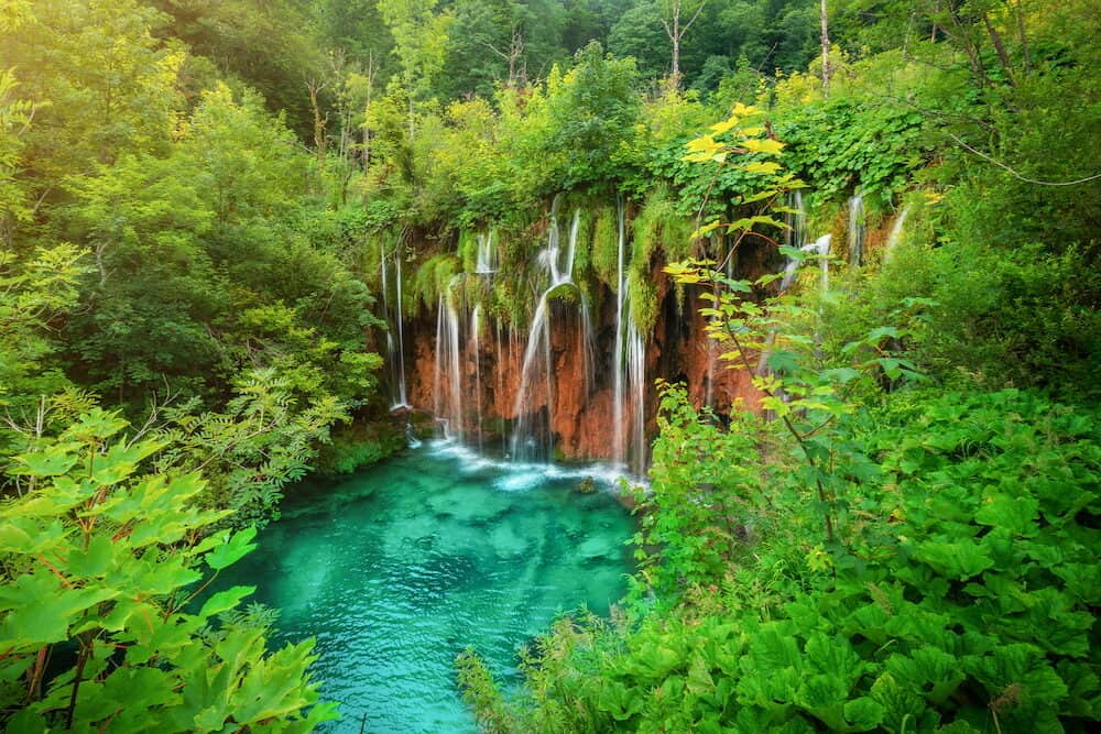 Exotic waterfall and lake landscape of Plitvice Lakes National Park, UNESCO natural world heritage and famous travel destination of Croatia. The lakes are located in central Croatia