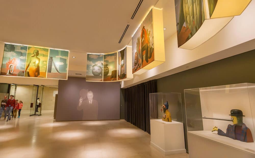 BRUSSELS, BELGIUM - : Visitors inside hall of Rene Magritte Museum with 200 original paintings, artworks, sculptures. Opened in 2009, museum dedicated to Belgian surrealist artist