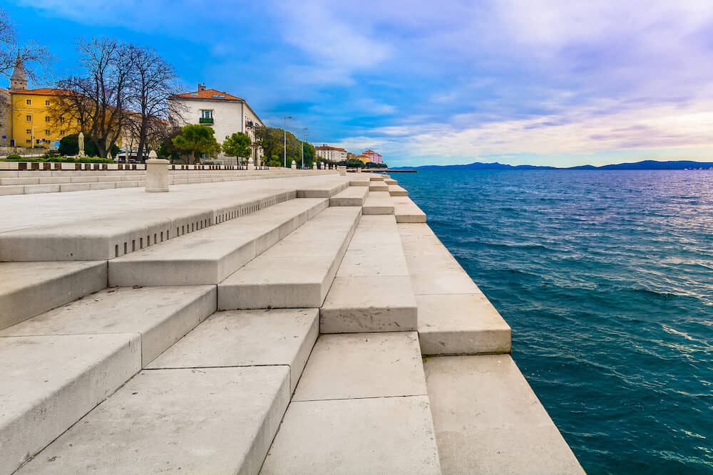 Scenic view at coastal town Zadar and famous landmark on city promenade, Sea Organ, Croatia Europe.