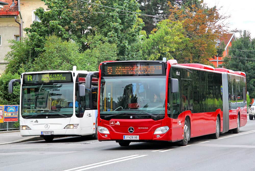 INNSBRUCK AUSTRIA - : Modern urban buses Mercedes-Benz O530 Citaro G at the city street.