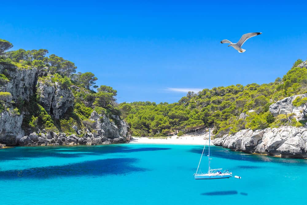 Cala Macarelleta Beach with Turquoise Water of Mediterranean Sea. Menorca Island Travel Background.