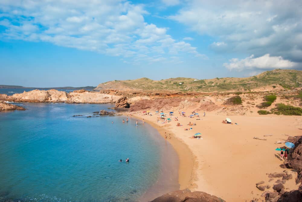 Sand beach with Caribbean sea in the north of Menorca island