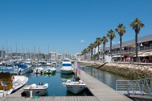 Where To Stay In Lagos Portugal Best Places To Stay For 2024   Lagos People Walking Through The Marina Of The City Of Lagos In Portugal In The Algarve. 500x333 