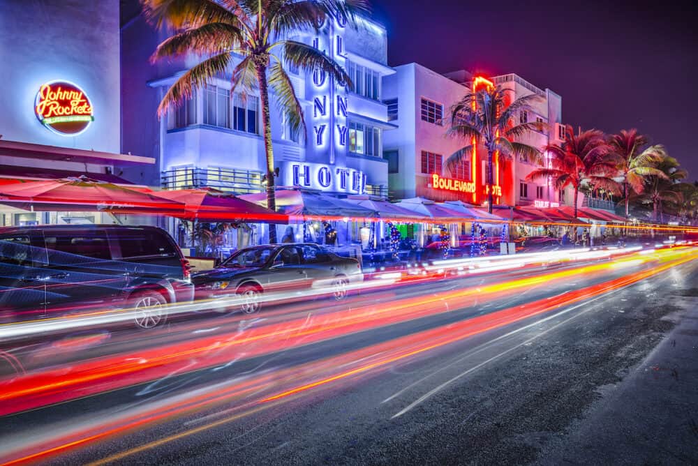 MIAMI, FLORIDA - Cars speed down Ocean Drive. The road is the main thoroughfare through South Beach.
