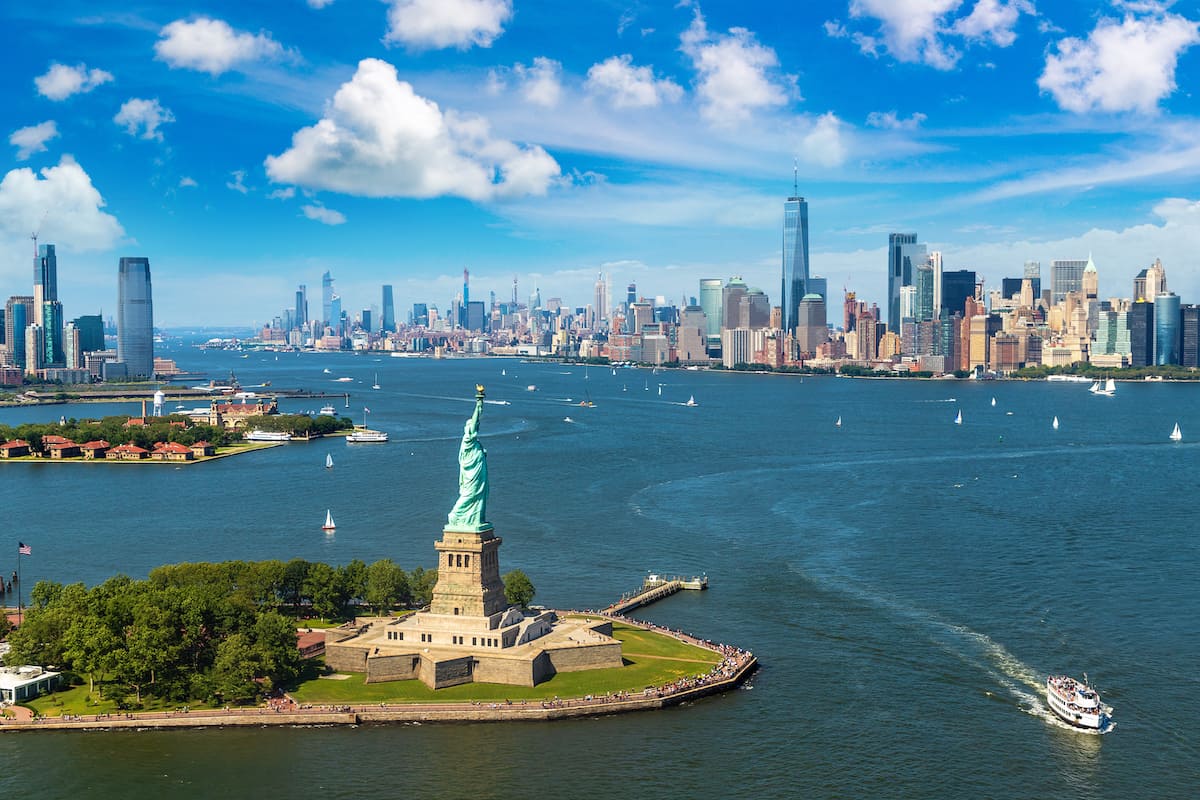 Panoramic aerial view Statue of Liberty and Jersey City and Manhattan cityscape in New York City, NY, USA