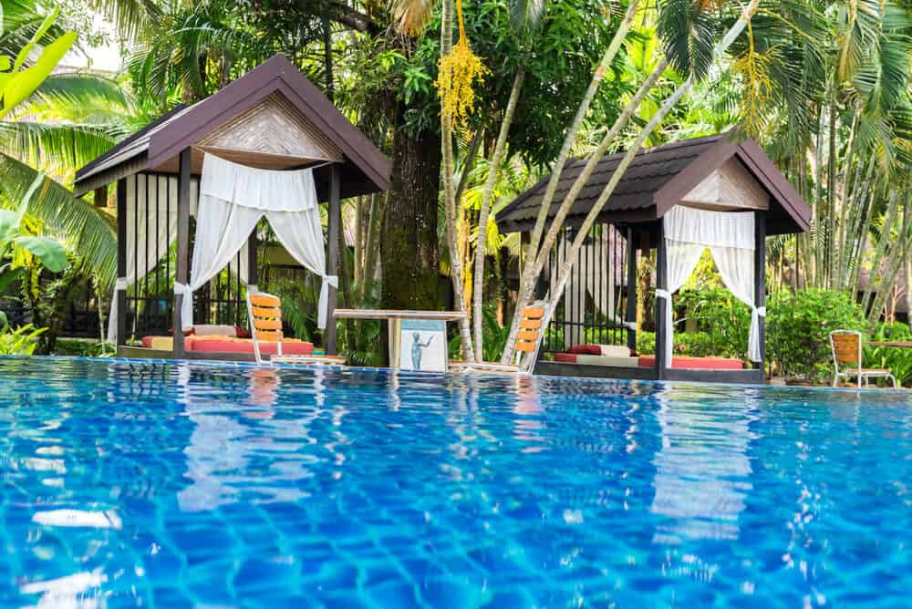 Place for Thai massage at beautiful swimming pool in tropical resort, Koh Chang island, Thailand.